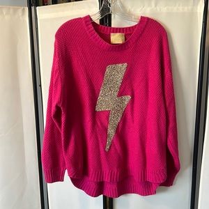 Judith March hot pink sweater with gold lighting bolt